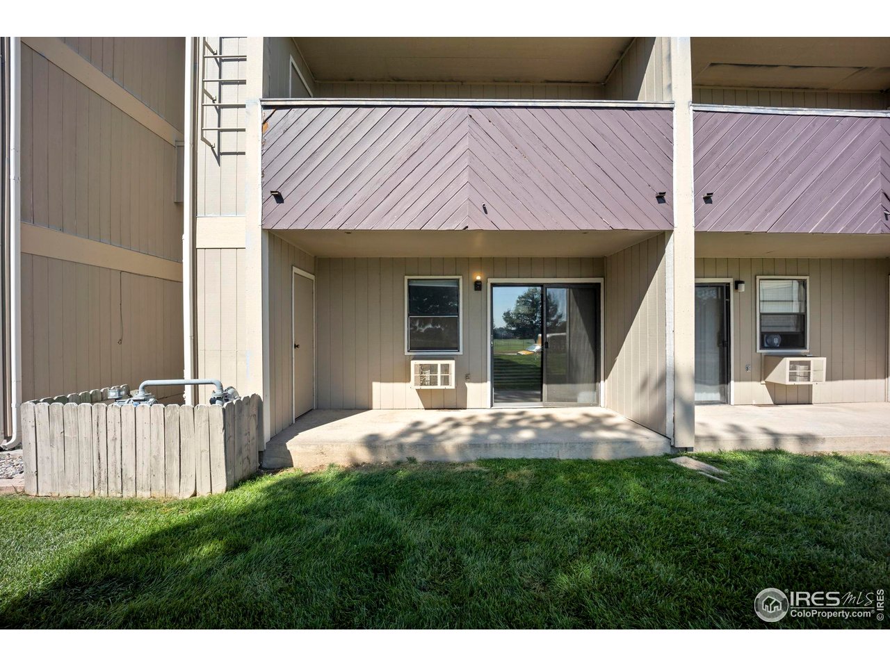 3431 Stover Street, Unit 513 Fort Collins, CO 80525 - Photo 4 of 28 a view of a house with backyard porch and sitting area
