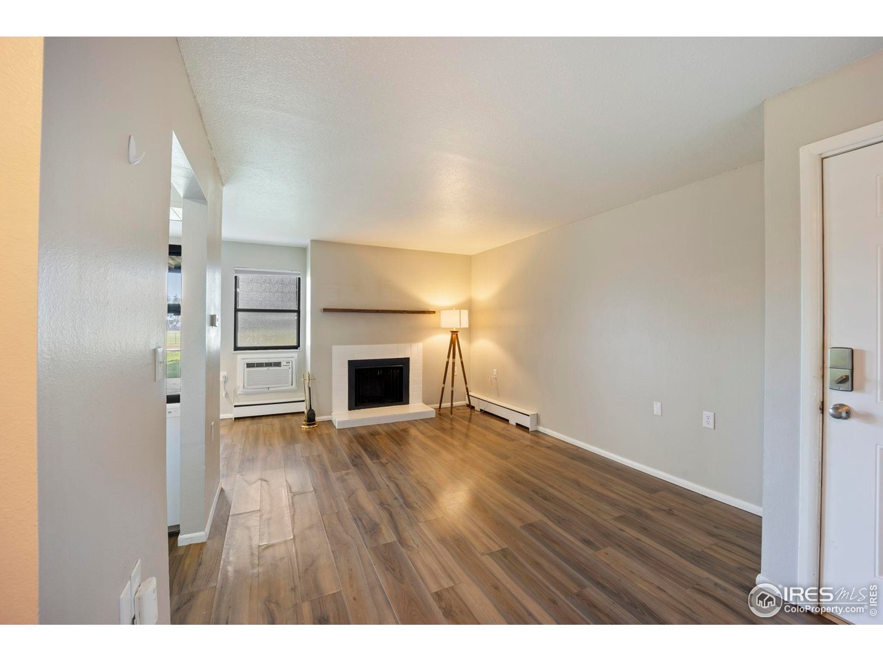 3431 Stover Street, Unit 513 Fort Collins, CO 80525 - Photo 7 of 28 a view of empty room with wooden floor
