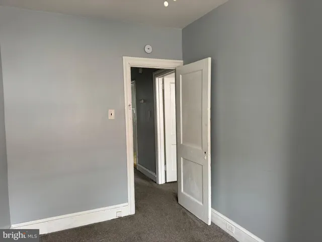 a view of a hallway with closet area