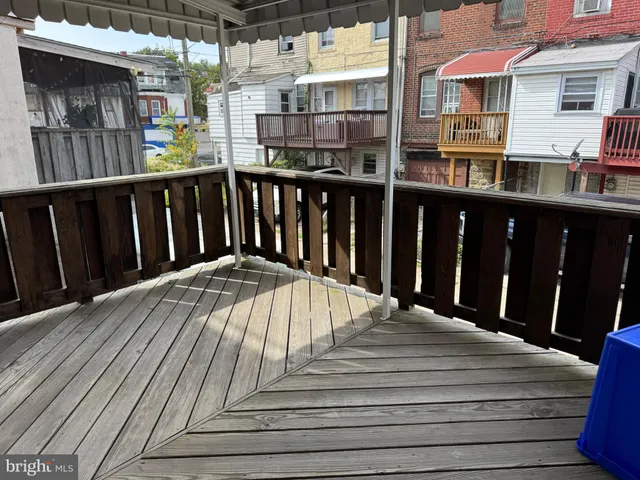 a view of a balcony with wooden floor