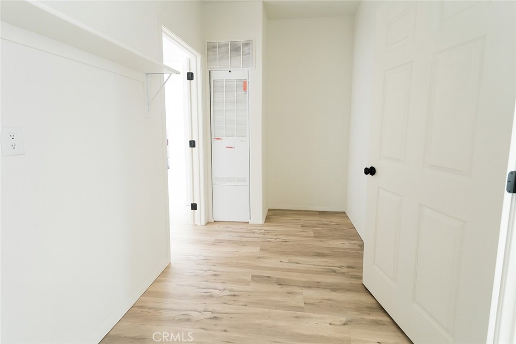21621 Sandia Road, Unit 150 Apple Valley, CA 92308 - Photo 17 of 45 a view of a bathroom with wooden floor