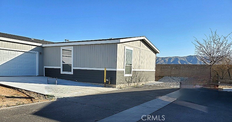 21621 Sandia Road, Unit 150 Apple Valley, CA 92308 - Photo 2 of 45 a view of house with backyard and kitchen