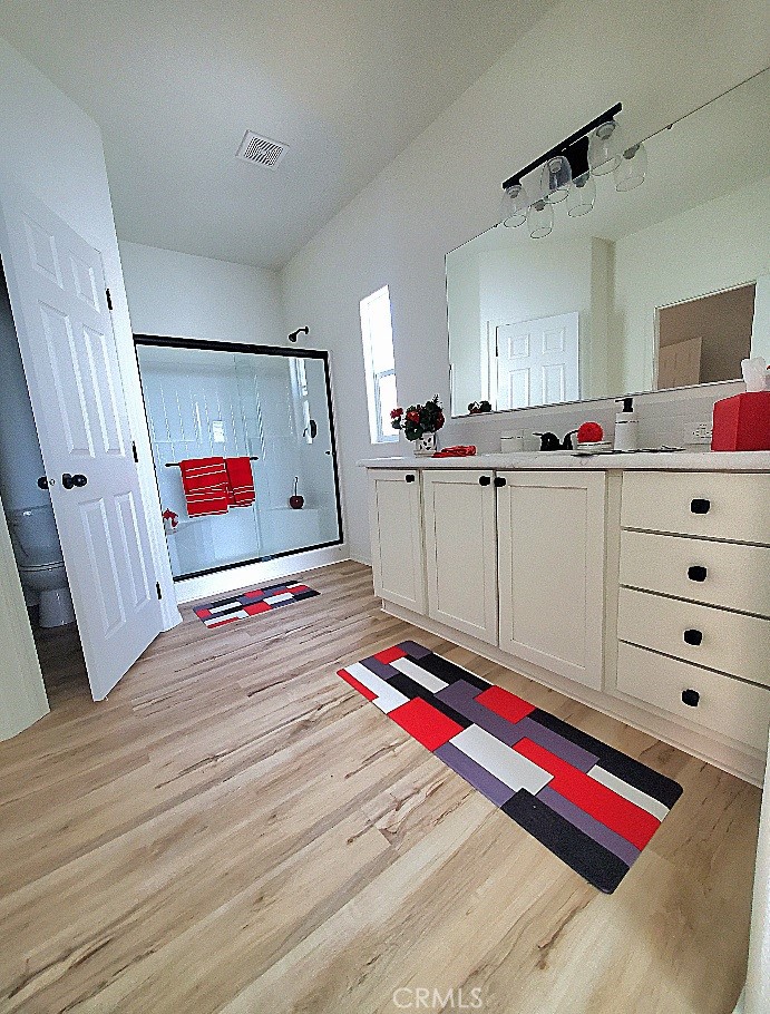 21621 Sandia Road, Unit 150 Apple Valley, CA 92308 - Photo 21 of 45 a room with cabinets and flat screen tv