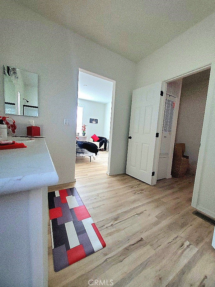 21621 Sandia Road, Unit 150 Apple Valley, CA 92308 - Photo 22 of 45 a living room with a rug and white walls