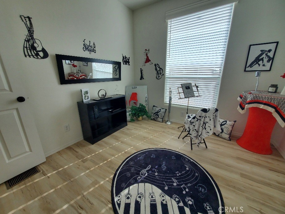 21621 Sandia Road, Unit 150 Apple Valley, CA 92308 - Photo 28 of 45 a view of a livingroom with furniture and a flat screen tv