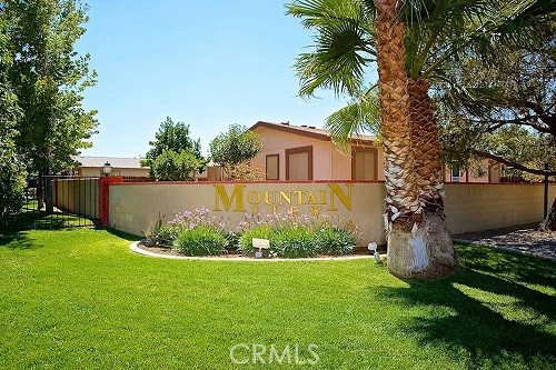 21621 Sandia Road, Unit 150 Apple Valley, CA 92308 - Photo 34 of 45 a view of a garden with plants and large trees