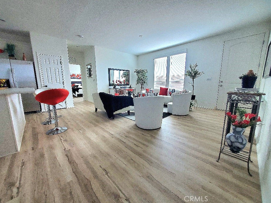 21621 Sandia Road, Unit 150 Apple Valley, CA 92308 - Photo 10 of 45 a living room with furniture and wooden floor
