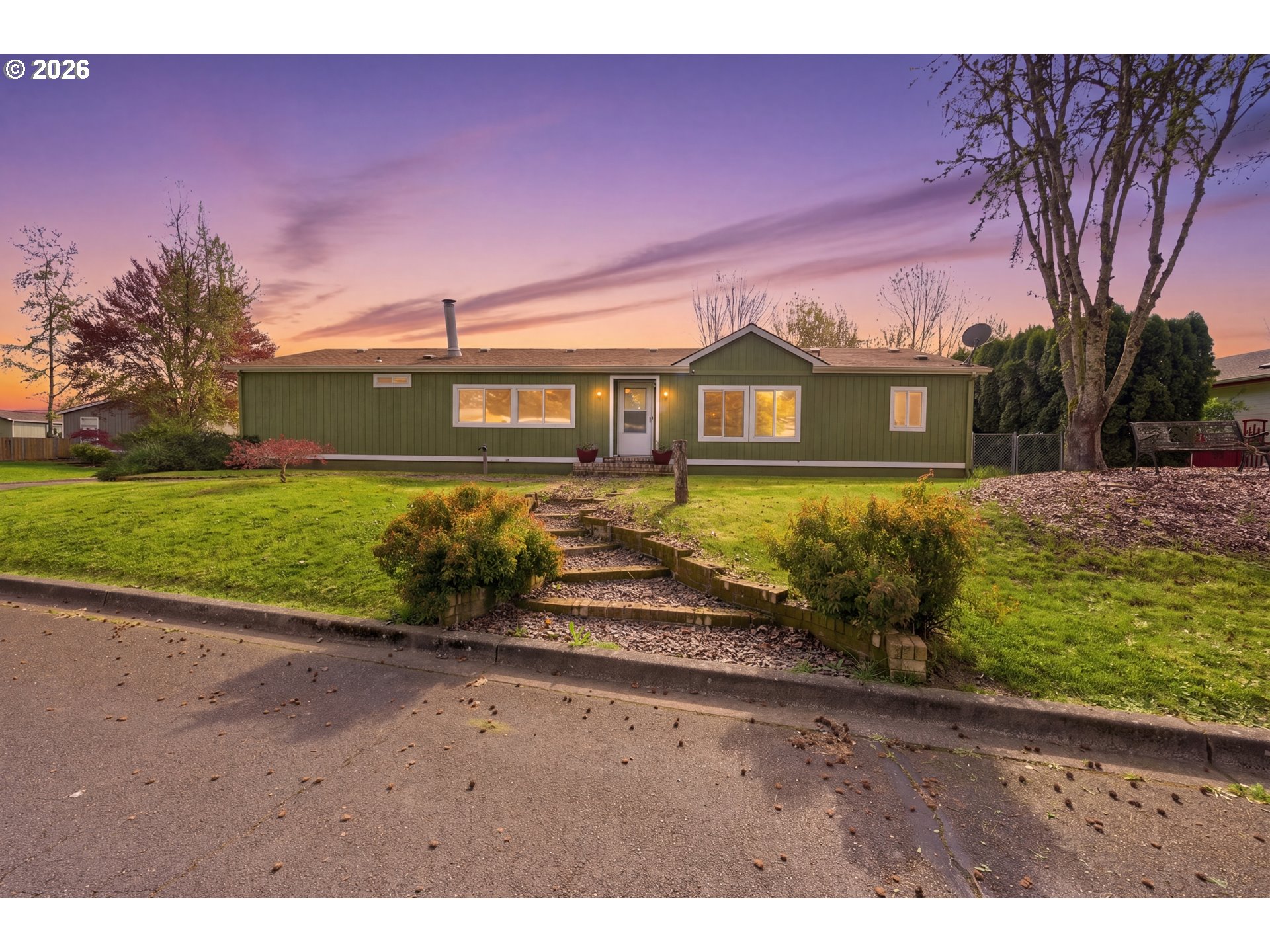 a front view of a house with a yard