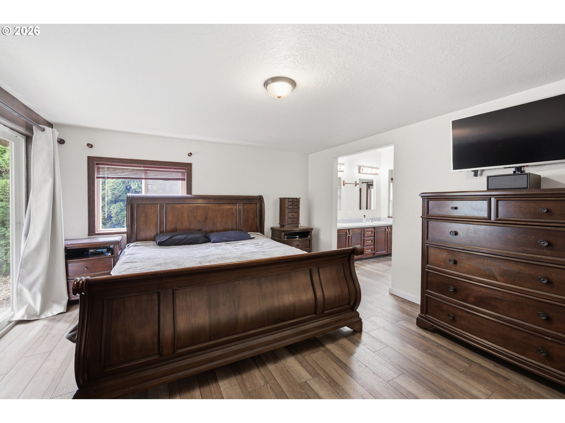 655 Northeast Burnett Road, Unit 91 McMinnville, OR 97128 - Photo 18 of 27 a living room with furniture and a flat screen tv