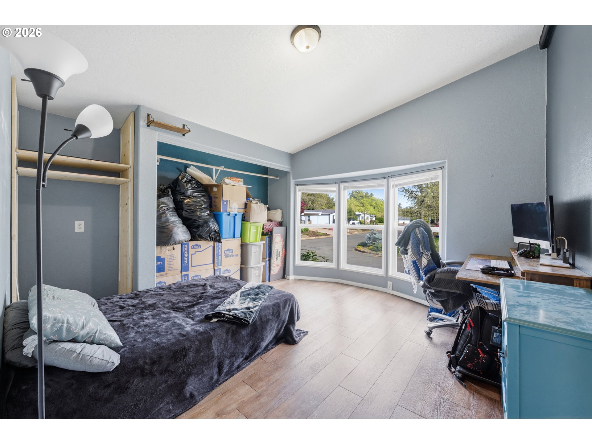 655 Northeast Burnett Road, Unit 91 McMinnville, OR 97128 - Photo 23 of 27 a bedroom with a bed and a desk