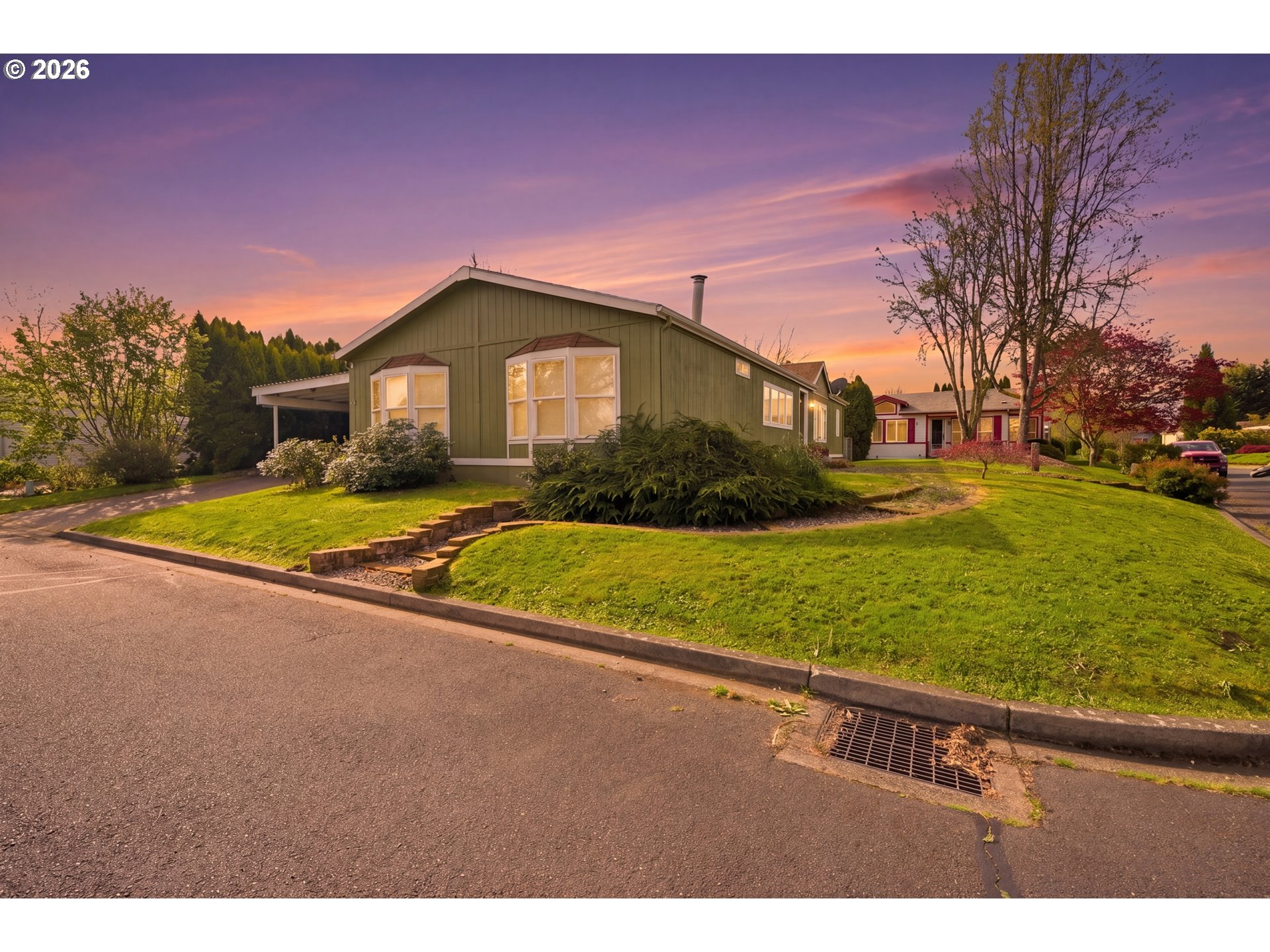 655 Northeast Burnett Road, Unit 91 McMinnville, OR 97128 - Photo 3 of 27 a view of a house with a yard
