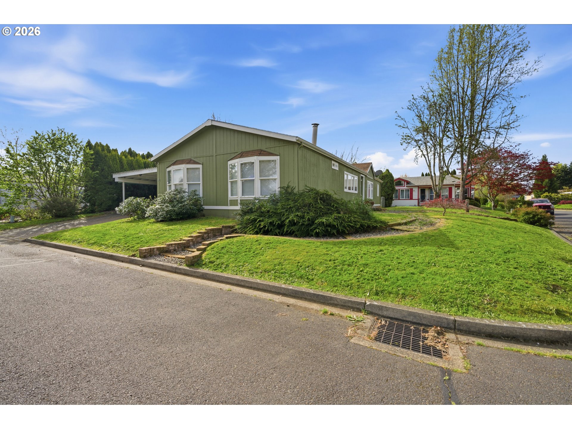 655 Northeast Burnett Road, Unit 91 McMinnville, OR 97128 - Photo 4 of 27 a front view of a house with a yard