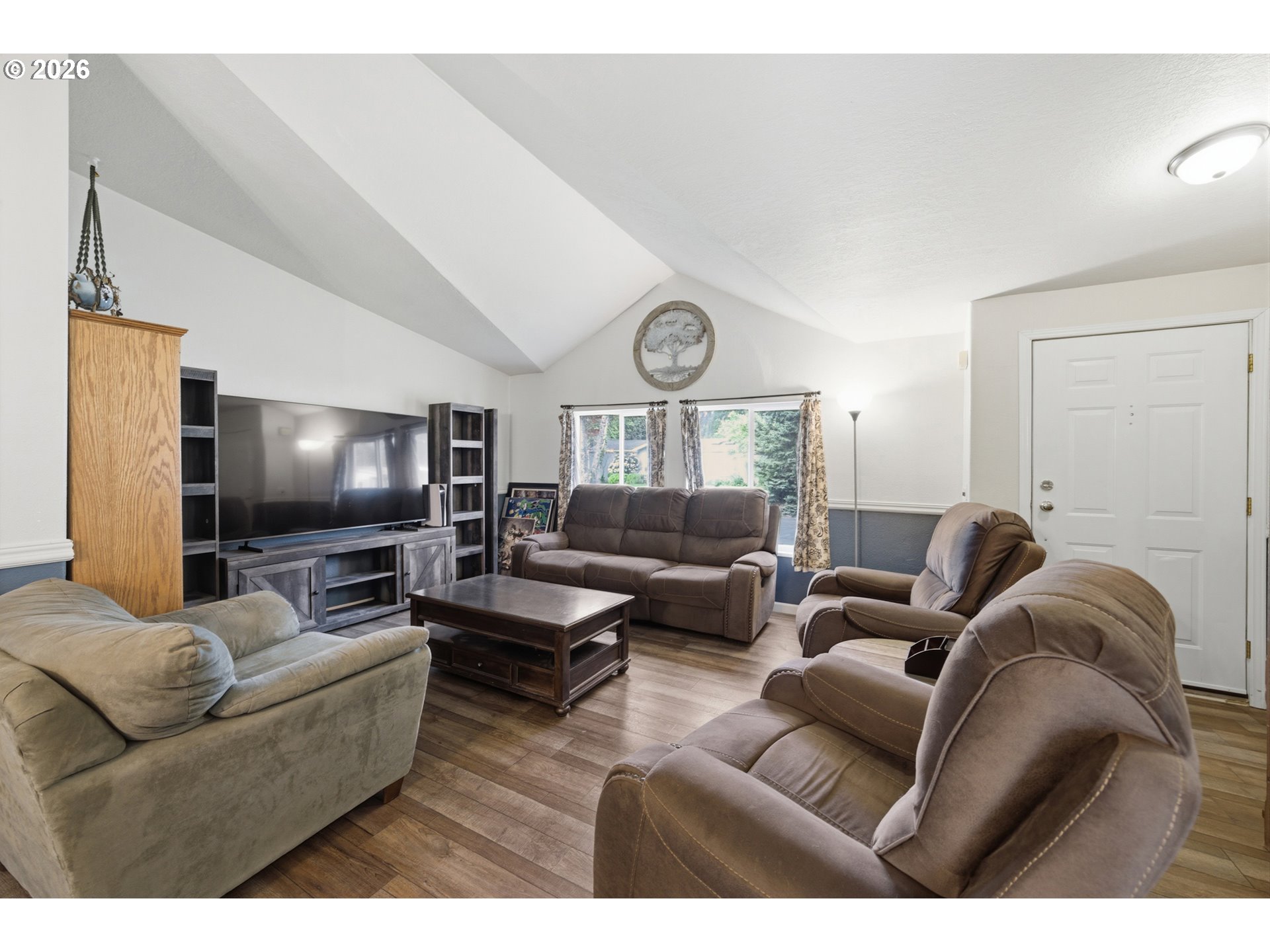 655 Northeast Burnett Road, Unit 91 McMinnville, OR 97128 - Photo 9 of 27 a living room with furniture and a flat screen tv