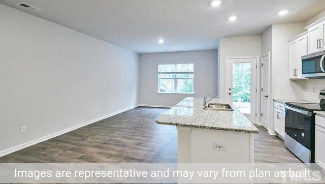 a view of living room with granite countertop furniture and fireplace