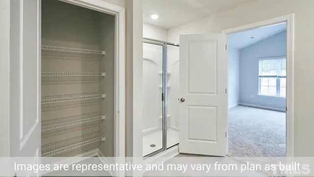 a view of a bathroom from a hallway