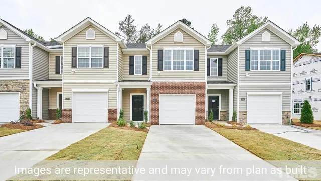 a view of a brick house with many windows