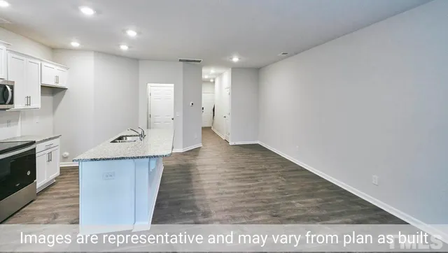 a view of a kitchen with a sink