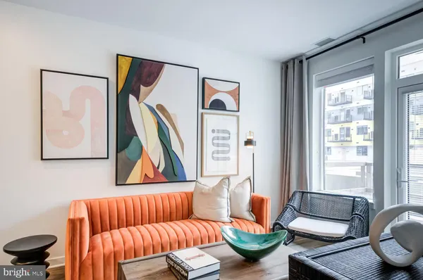 a bedroom with a bed and a potted plant