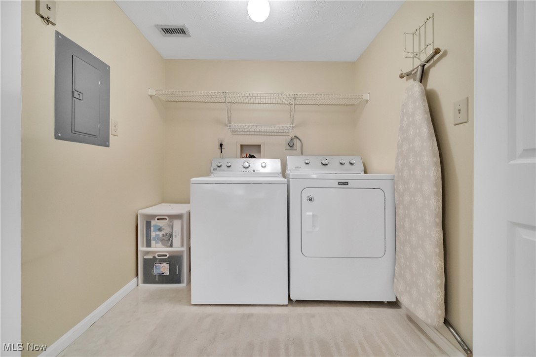 22481 Center Ridge Road, Unit 202 Rocky River, OH 44116 - Photo 20 of 24 Laundry area with electric panel and washer and clothes dryer