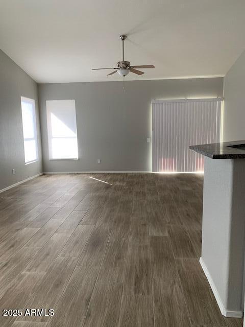 1373 West Kesler Lane Chandler, AZ 85224 - Photo 11 of 25 a view of an empty room with wooden floor and a window