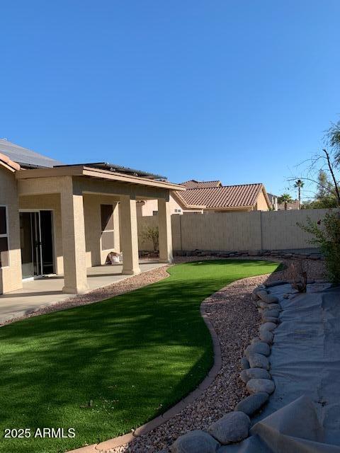 1373 West Kesler Lane Chandler, AZ 85224 - Photo 2 of 25 a front view of a house with a garden
