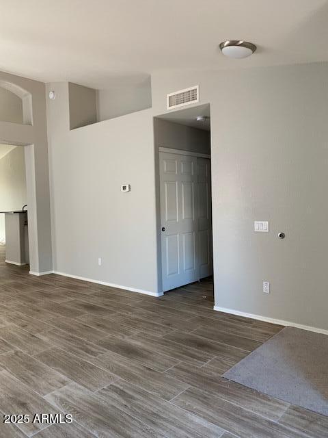 1373 West Kesler Lane Chandler, AZ 85224 - Photo 25 of 25 a view of an empty room with wooden floor and a ceiling fan