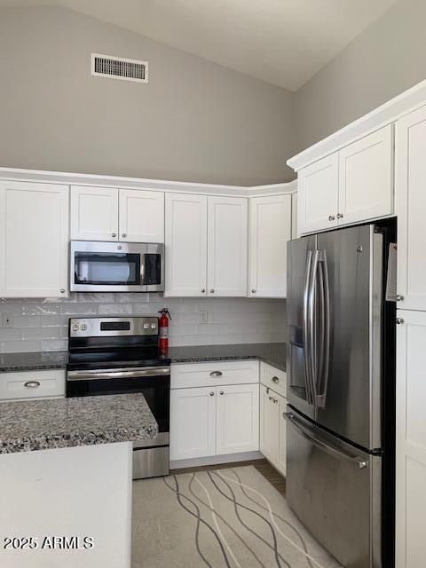 1373 West Kesler Lane Chandler, AZ 85224 - Photo 6 of 25 a kitchen with granite countertop a refrigerator sink and cabinets