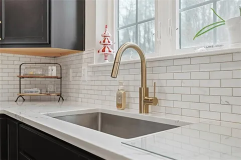 a dining room with furniture a chandelier and a rug