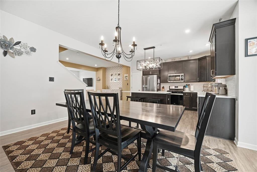 155 Craig Street Imperial, PA 15126 - Photo 14 of 39 a view of a dining room with furniture and wooden floor