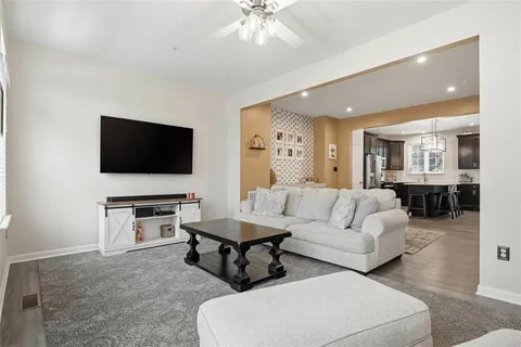 a bathroom with a sink mirror and toilet