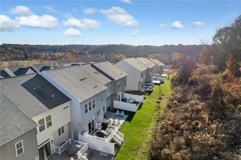 an aerial view of a house with a garden