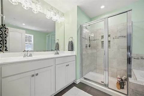 a bathroom with a tub and a shower