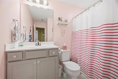 a bedroom with two beds and a window