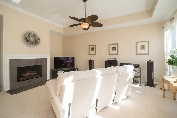 a spacious bedroom with a bed and a flat screen tv