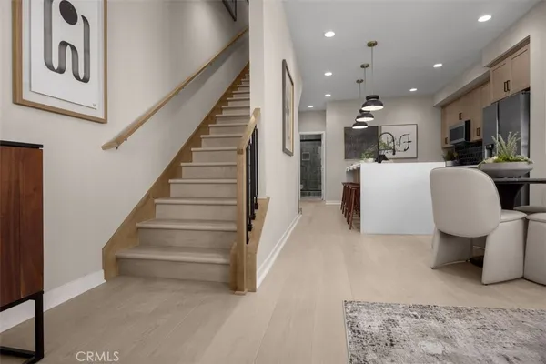 a living room with furniture and a painting