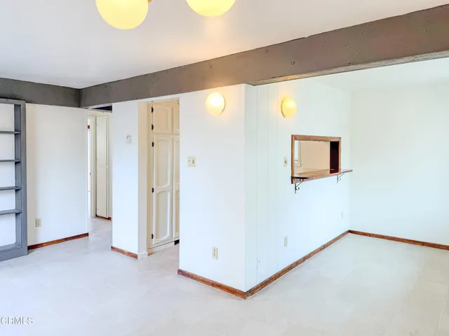 a view of a room with wooden floor