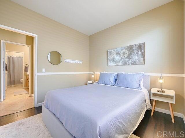 80596 Key Largo Avenue Indio, CA 92201 - Photo 17 of 59 a bedroom with a bed and a painting on the wall