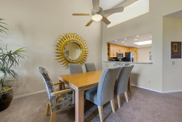 a dining room with furniture and window
