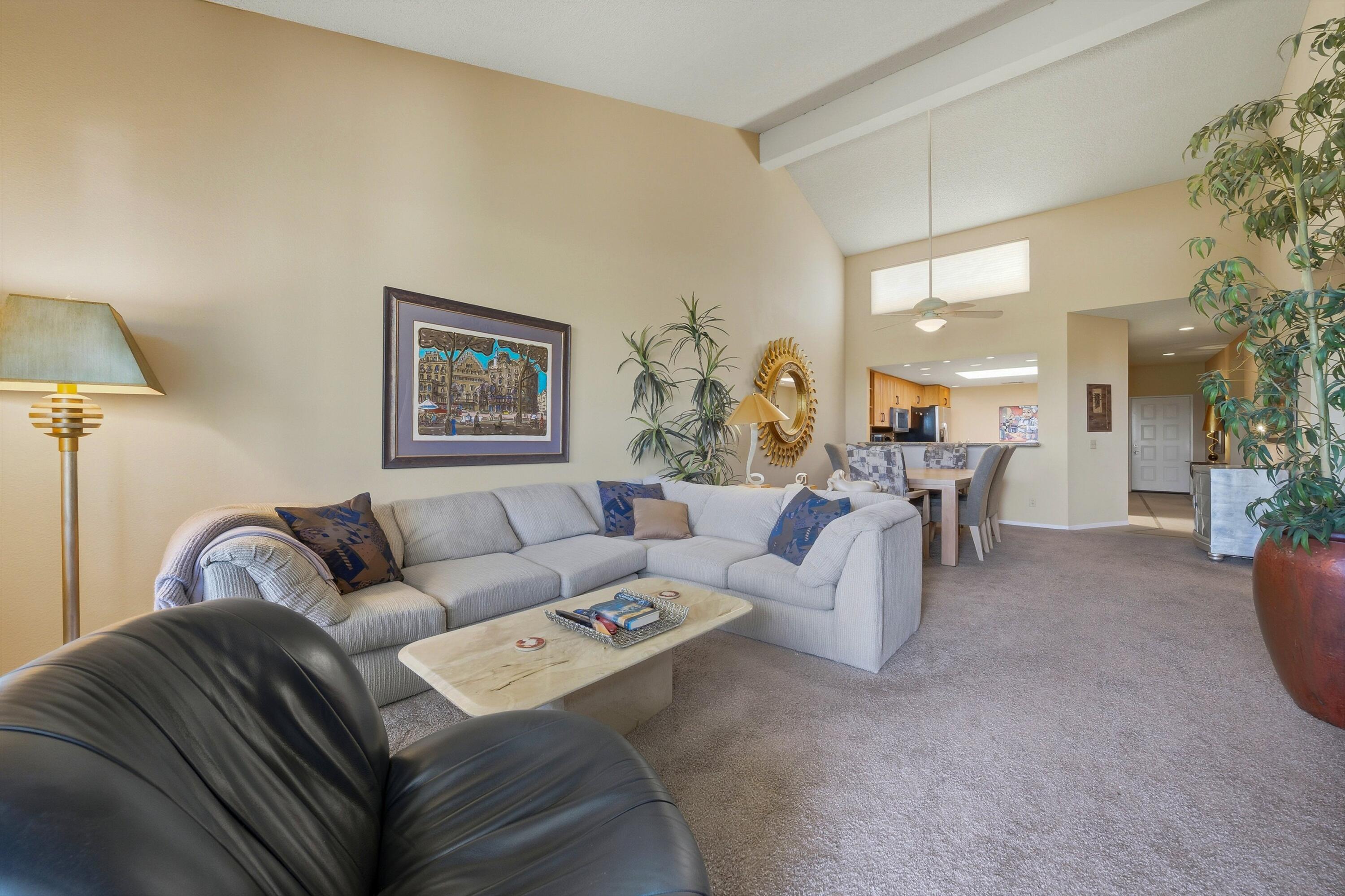 54860 Inverness Way La Quinta, CA 92253 - Photo 21 of 26 a living room with furniture and a lamp