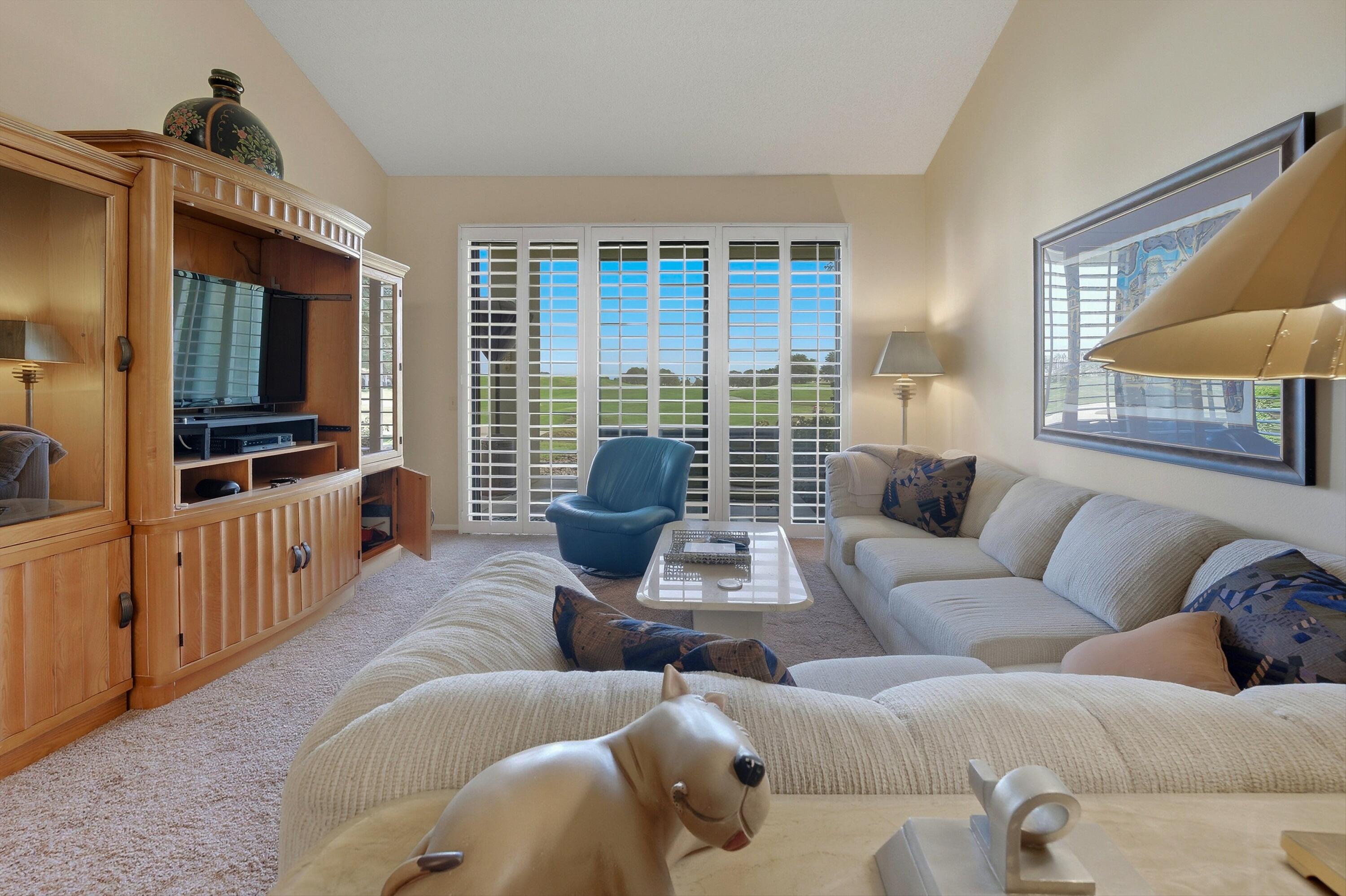 54860 Inverness Way La Quinta, CA 92253 - Photo 23 of 26 a living room with furniture and a flat screen tv