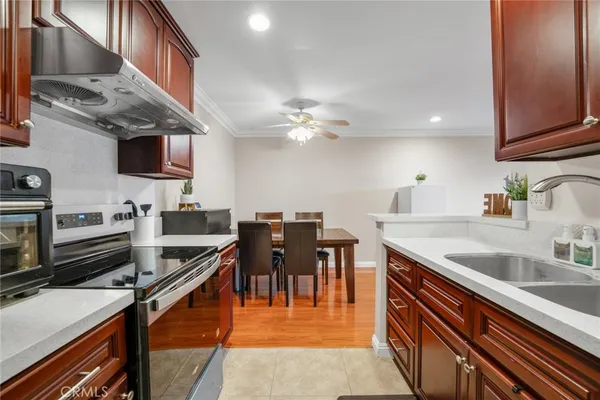 a kitchen with stainless steel appliances granite countertop a sink counter space and cabinets