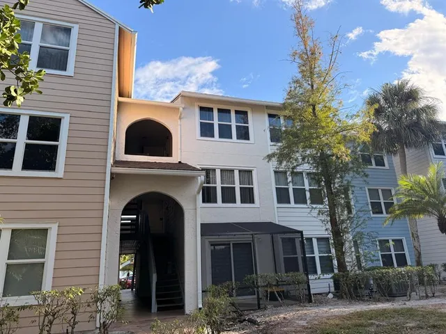 a large building with a door and a yard