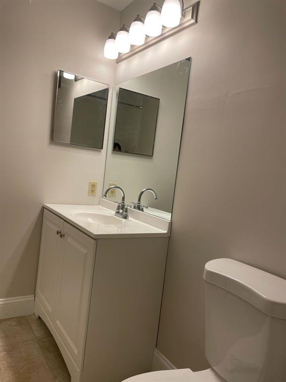2305 North Congress Avenue Boynton Beach, FL 33426 - Photo 8 of 12 a bathroom with a sink mirror and toilet