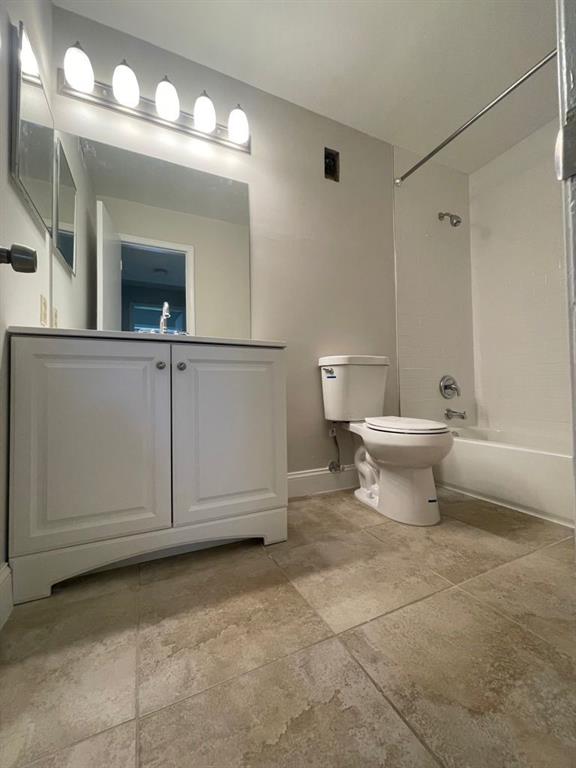 2305 North Congress Avenue Boynton Beach, FL 33426 - Photo 9 of 12 a bathroom with a toilet sink and mirror