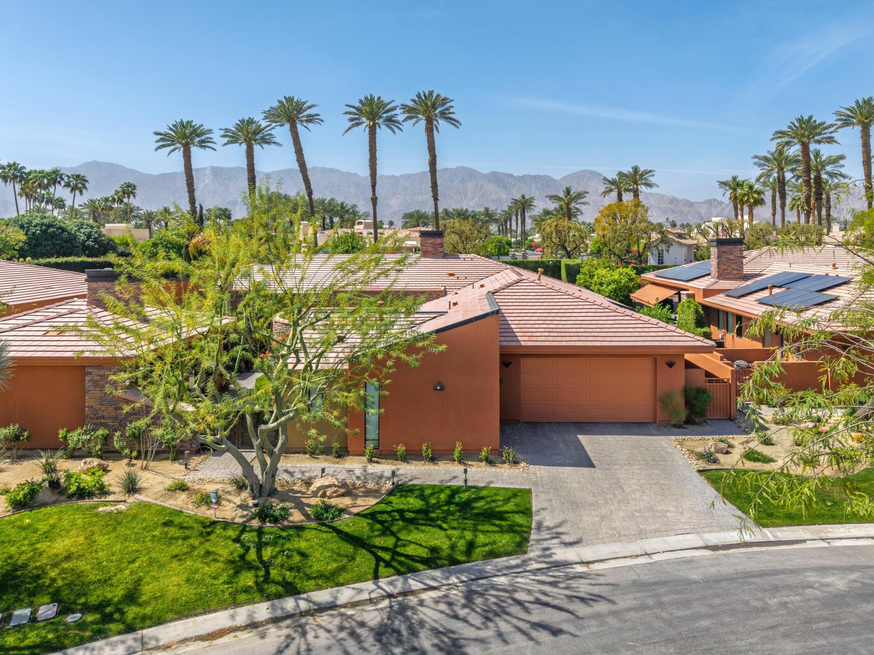 79625 Vía Sin Cuidado La Quinta, CA 92253 - Photo 13 of 52 a aerial view of a house with a garden and plants
