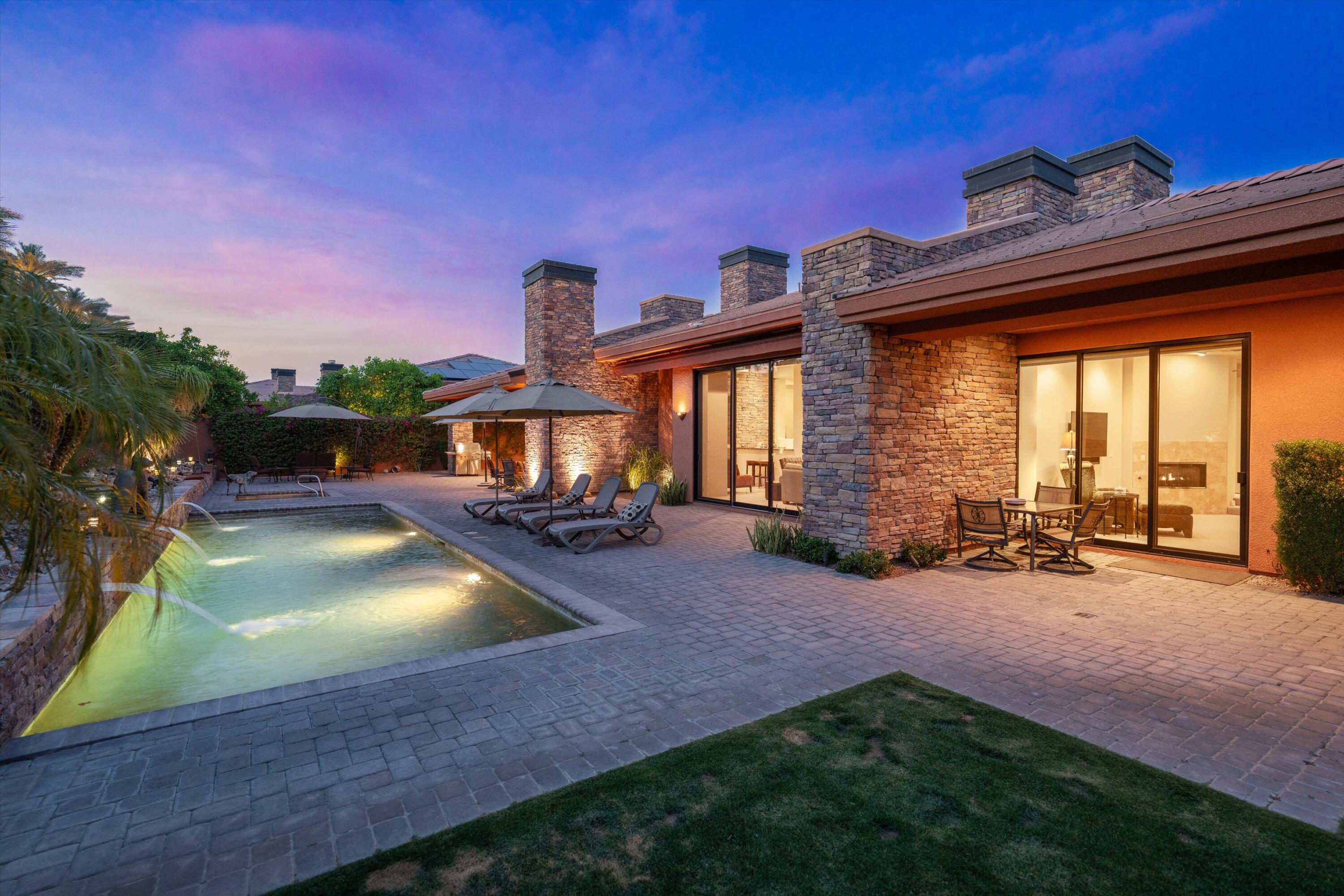 79625 Vía Sin Cuidado La Quinta, CA 92253 - Photo 2 of 52 a view of a house with a backyard porch and sitting area