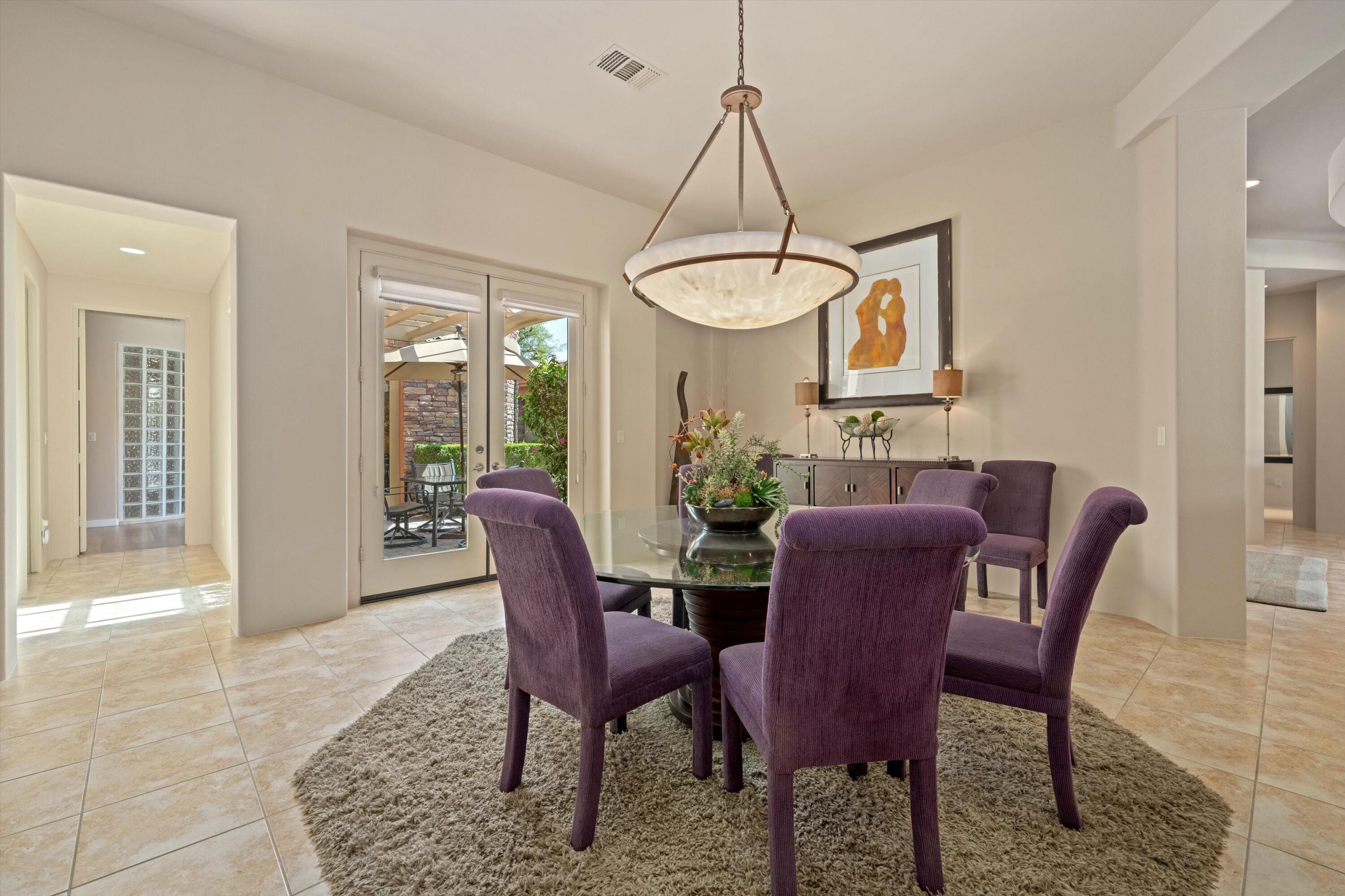 79625 Vía Sin Cuidado La Quinta, CA 92253 - Photo 33 of 52 a view of a dining room with furniture