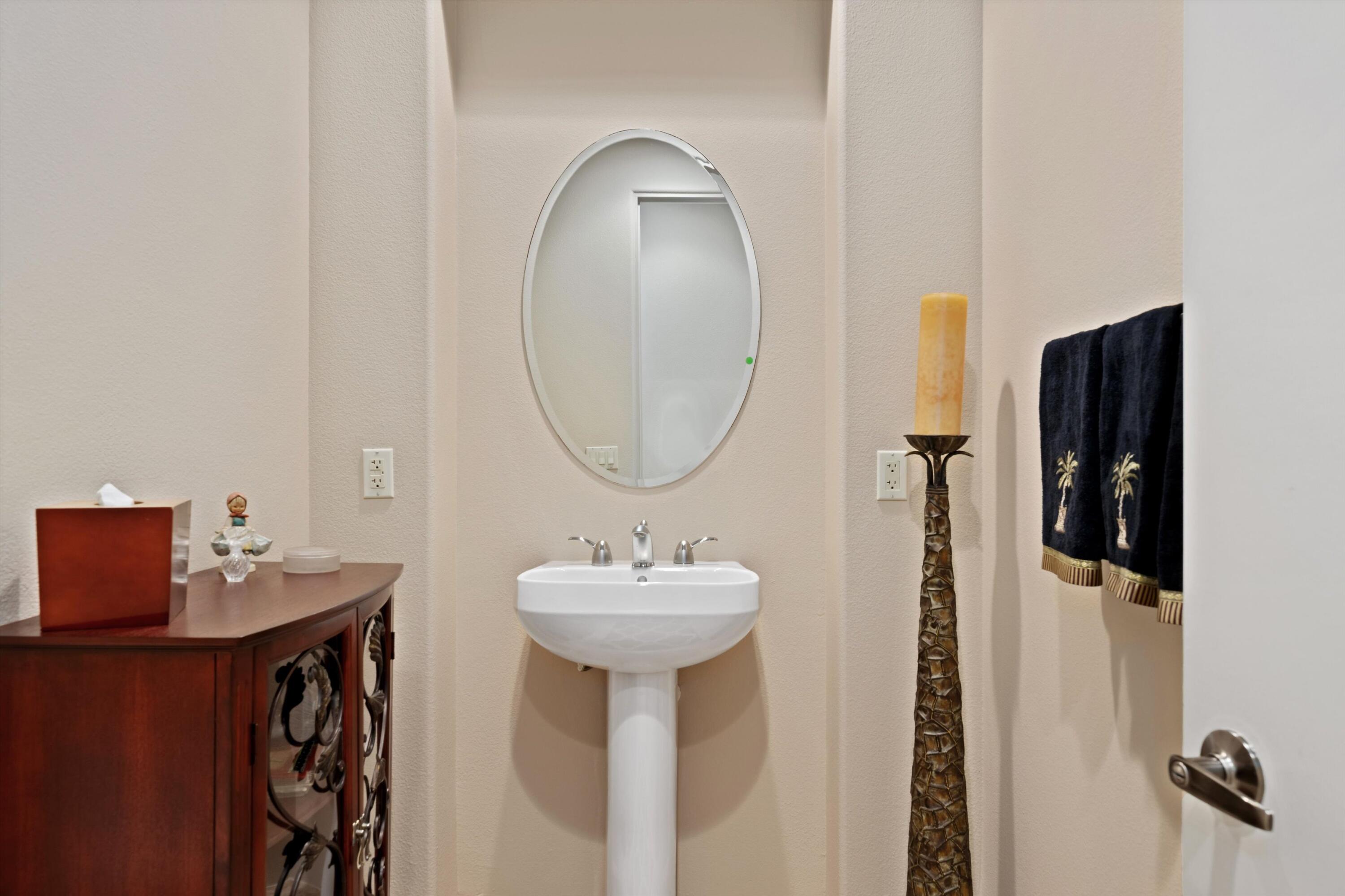 79625 Vía Sin Cuidado La Quinta, CA 92253 - Photo 35 of 52 a bathroom with a sink and a mirror