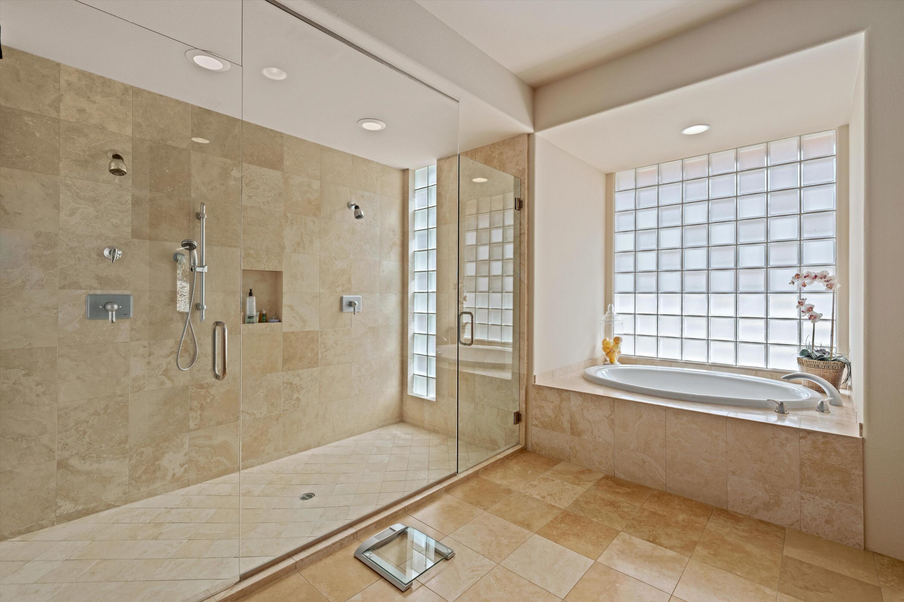 79625 Vía Sin Cuidado La Quinta, CA 92253 - Photo 38 of 52 a bathroom with a bathtub and a shower