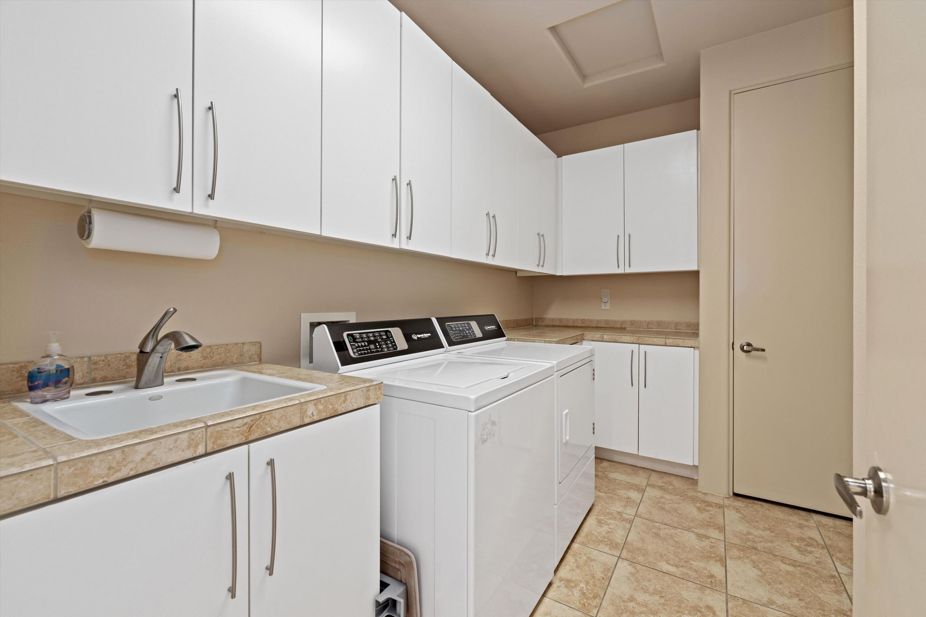 79625 Vía Sin Cuidado La Quinta, CA 92253 - Photo 45 of 52 a utility room with sink dryer and washer